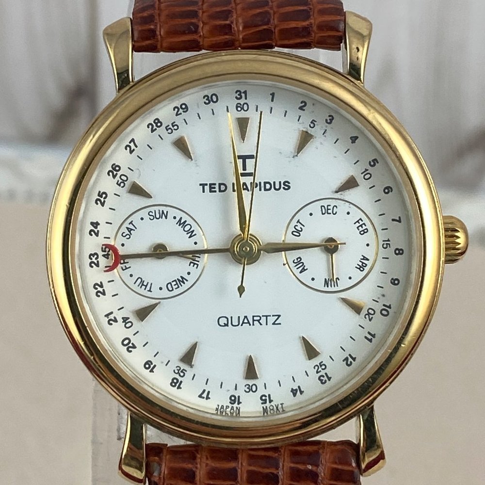 Ted Lapidus Gold Tone Case Quartz Analog UNISEX Watch 4 Hand White Enamel Dial